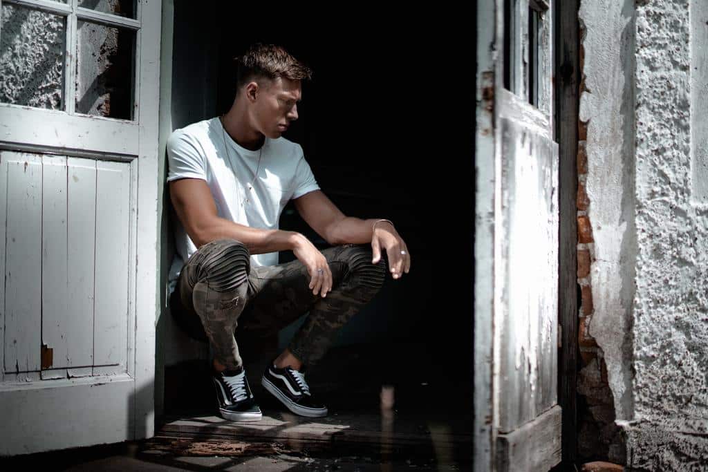 man sitting in a doorway